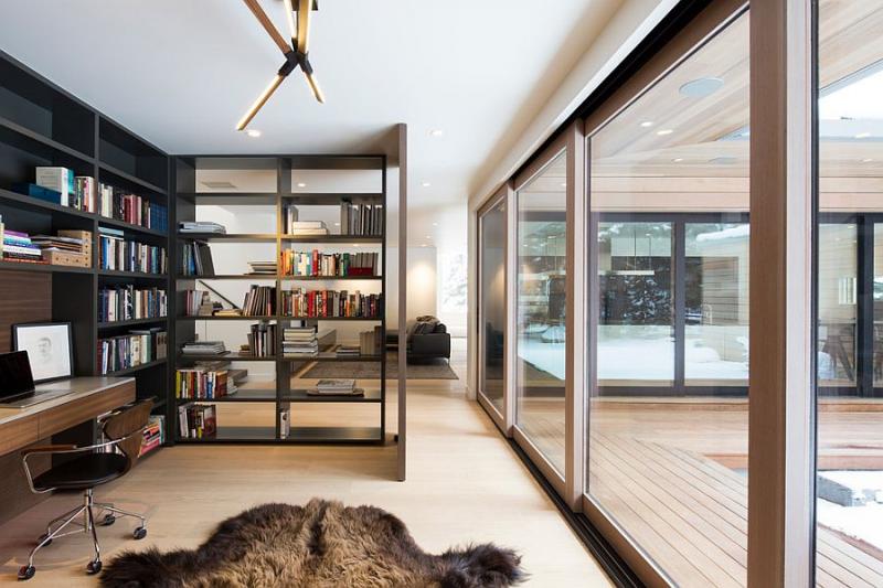 Open-bookshelf-adds-as-a-divider-between-the-home-office-and-living-room.jpg