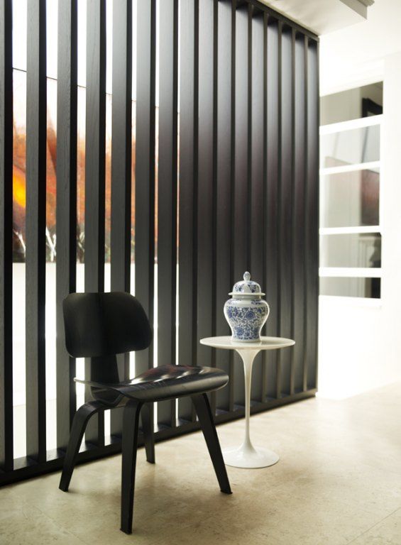 captivating-divider-walls-room-divider-wall-with-door-wood-floor-black-seat-white-wall.jpg