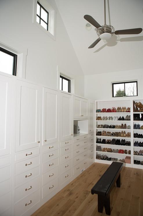 walk-in-closet-cathedral-ceiling-side-by-side-shoe-shelves.jpg